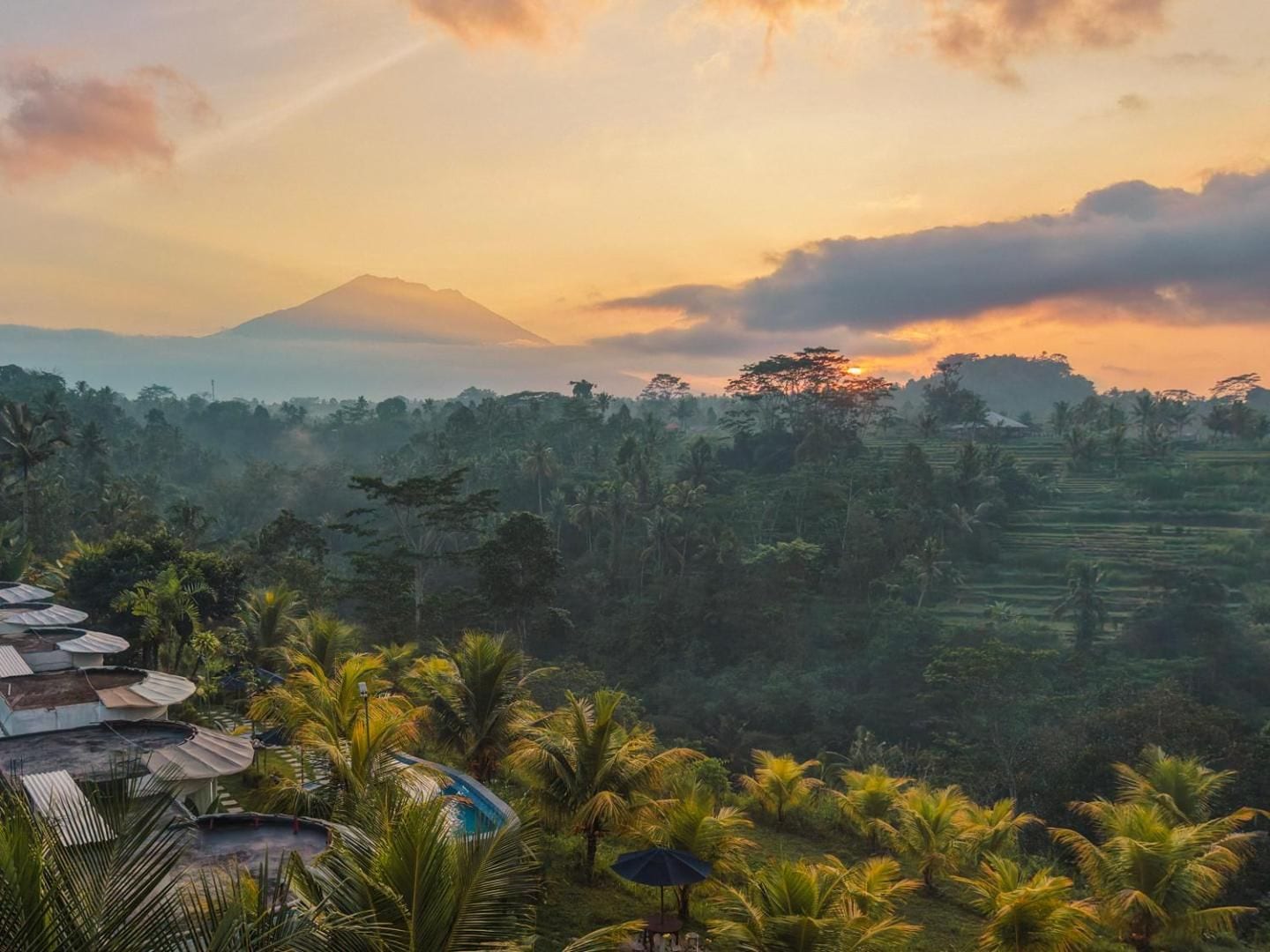 First light over the valley at De Sila House and Pool, Mount Agung on the horizon